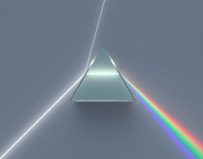 White light from the bottom left of the image travels upwards towards a glass prism in the centre. Some light is reflected, continuing to travel towards the centre top of the image. Most of the light leaves the prism and travels towards the bottom right of the image, now split into the different colours of the rainbow.