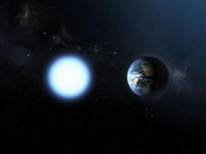 A graphic of the Earth is on the right against a blue-black background with a few small white dots, which are stars, visible. To the left of the planet is a glowing white-blue circle of roughly equal size.